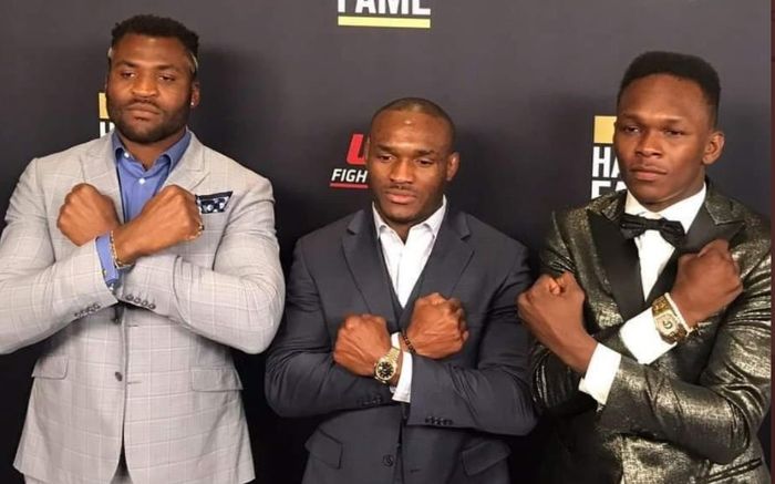 Tiga juara UFC asal Afrika: Francis Ngannou, Kamaru Usman, dan Israel Adesanya.