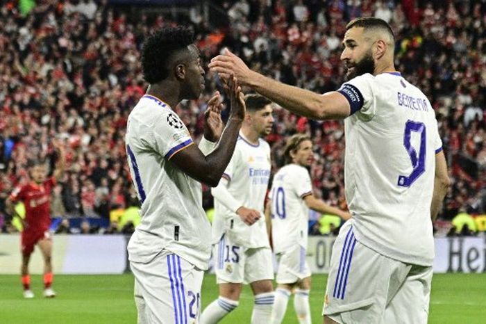 Vinicius Junior merayakan golnya untuk Real Madrid ke gawang Liverpool dalam laga final Liga Champions 2021-2022 di Stade de France, Sabtu (28/5/2022).