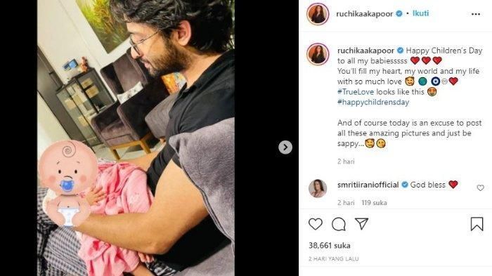Potret Shaheer Seikh saat memangku sang anak