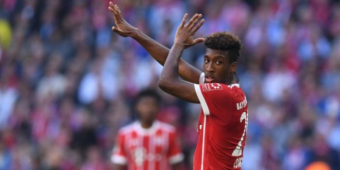 Pemain sayap Bayern Muenchen, Kingsley Coman, merayakan gol ke gawang Freiburg dalam partai Liga Jer