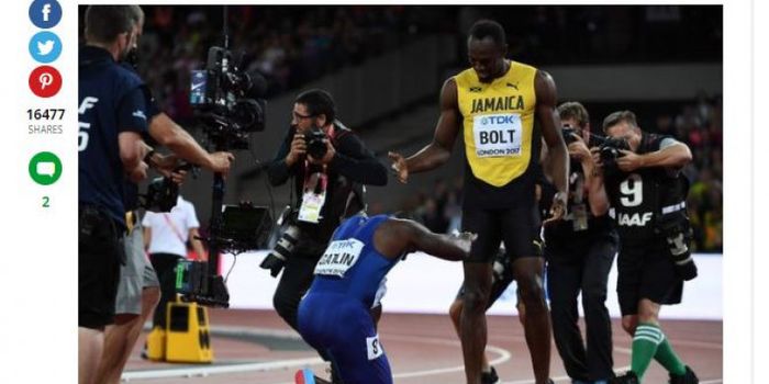 Justin Gatlin memberikan penghormatan kepada Usain Bolt. 