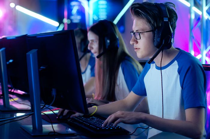 Team of Professional Cybersport Gamers Playing Video Games on a Cyber Games Tournament
