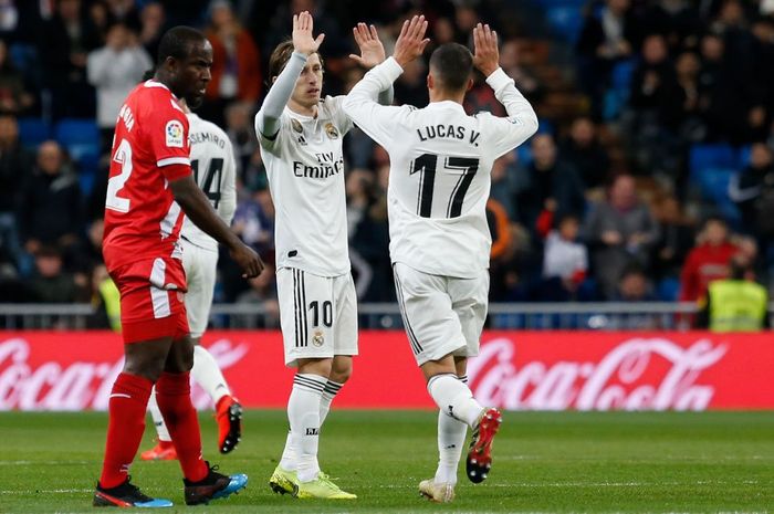 Lucas Vazquez merayakan gol bersama Luka Modric ke gawang Girona BOLASPORT.COM - Real Madrid menjamu