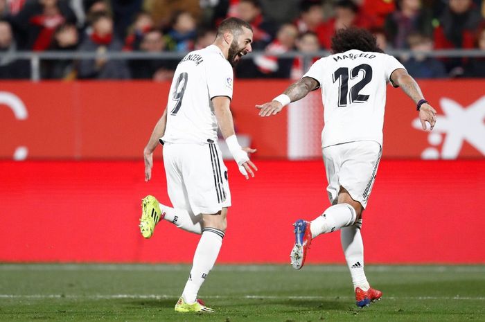 Dua pemain Real Madrid, Karim Benzema dan Marcelo, merayakan gol dalam laga leg kedua perempat final Copa del Rey melawan Girona di Stadion Municipal de Montilivi, 31 Januari 2019.