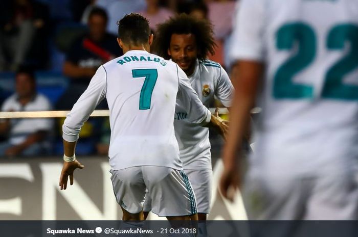 Penyerang Juventus, Cristiano Ronaldo, saat masih berseragam Real Madrid bersama  bek Marcelo Vieira.