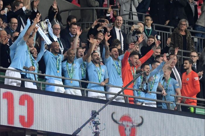 Manchester City sukses menjuarai Piala Liga Inggris 2018-2019 usai mengalahkan Chelsea lewat drama adu penalti di Stadion Wembley, Minggu (24/2/2019).