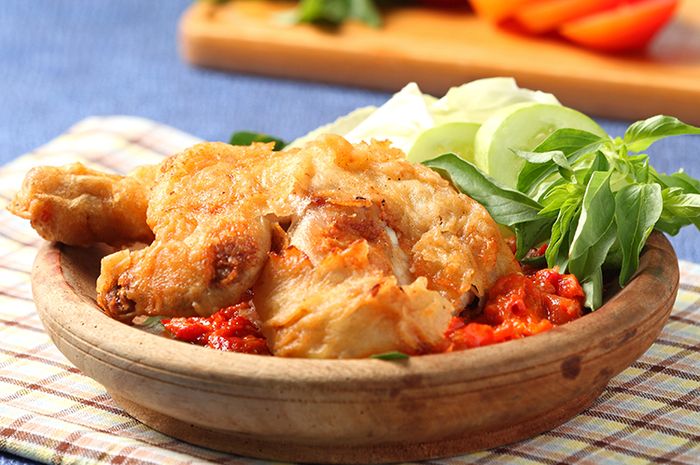 Learn to make juicy and crispy Ayam Goreng Tepung Penyet (battered fried chicken with spicy sambal) at home with this step-by-step recipe!
