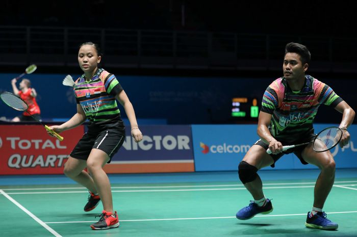 Pasangan ganda campuran Tontowi Ahmad/Winny Oktavina Kandow saat menjalani laga melawan Do Tuan Duc/Pham Nhu Thao (Vietnam) pada babak kesatu Malaysia Open 2019 di Axiata Arena, Bukit Jalil, Kuala Lumpur, Selasa (2/4/2019).