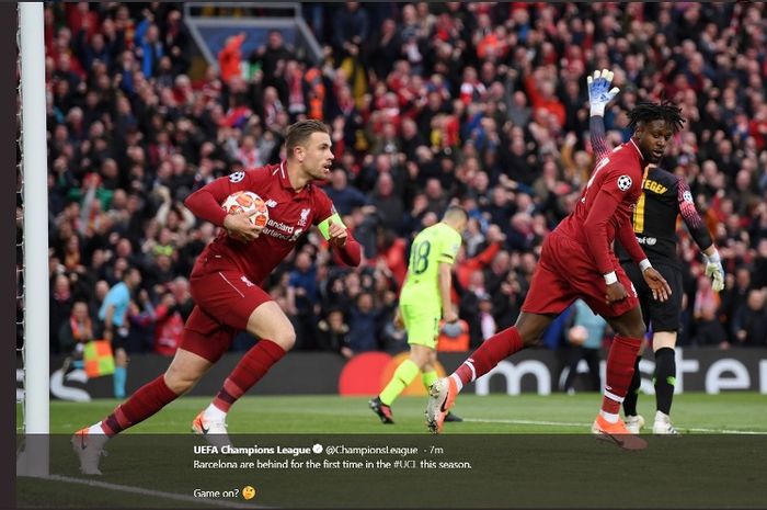 Striker Liverpool, Divock Origi, melakukan selebrasi seusai menjebol gawang Barcelona dalam leg kedua semifinal Liga Champions di Anfield, Selasa (7/5/2019).