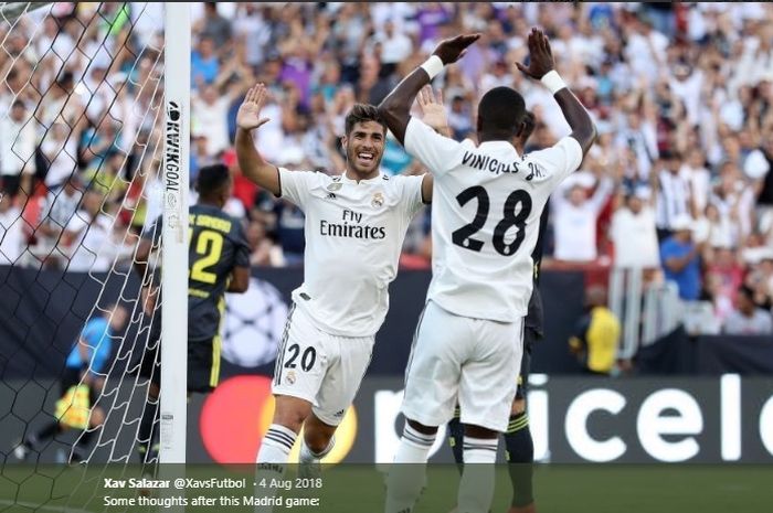 Marco Asensio dan Vinicius Jr merayakan selebrasi gol ketika melawan Juventus pada sebuah laga ujicoba pada Agustus 2018