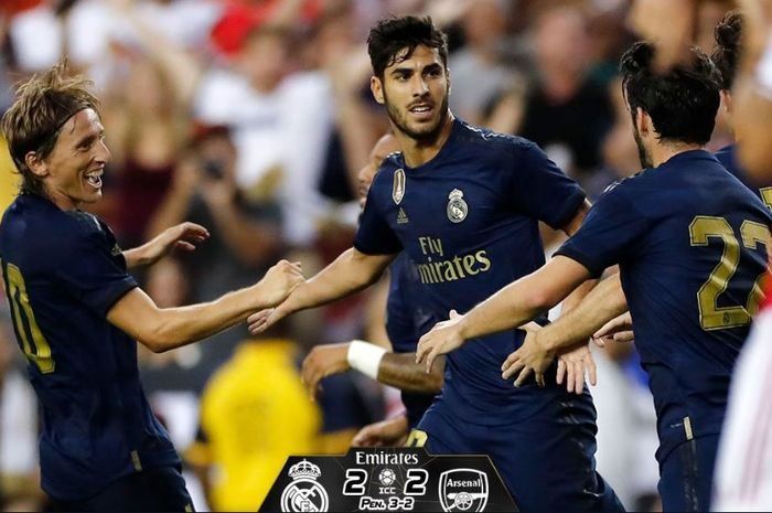 Penyerang Real Madrid, Marco Asensio (tengah), merayakan gol yang dicetak ke gawang Arsenal dalam laga International Champions Cup 2019 di FedEx Field, 23 Juli 2019.