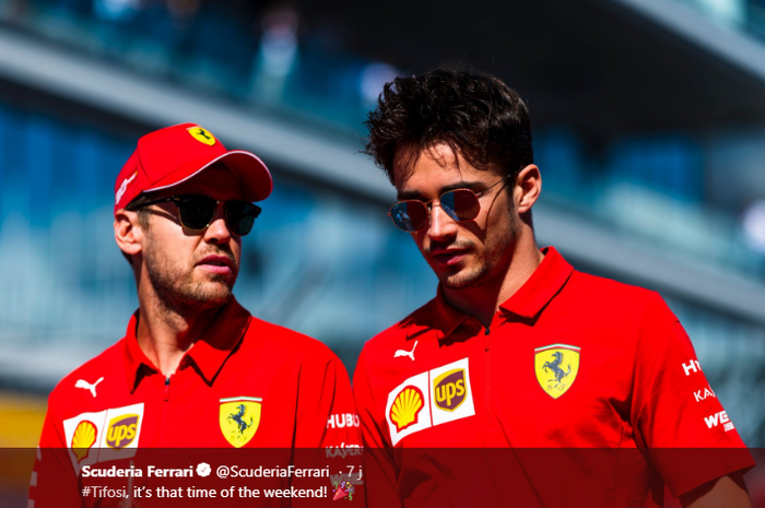 Dua pembalap Ferrari, Sebastian Vettel (kiri), berbicara kepada rekan setimnya, Charles Leclerc, jelang balapan F1 GP Rusia di Sirkuit Sochi, 29 September 2019.