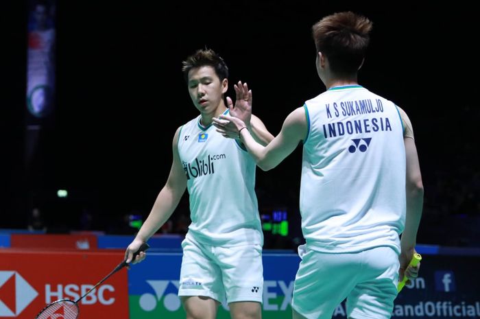 Pasangan ganda putra Indonesia, Marcus Fernaldi Gideon/Kevin Sanjaya Sukamuljo, pada babak kedua All England Open 2020 di Arena Birmingham, Inggris, Kamis (12/3/2020).