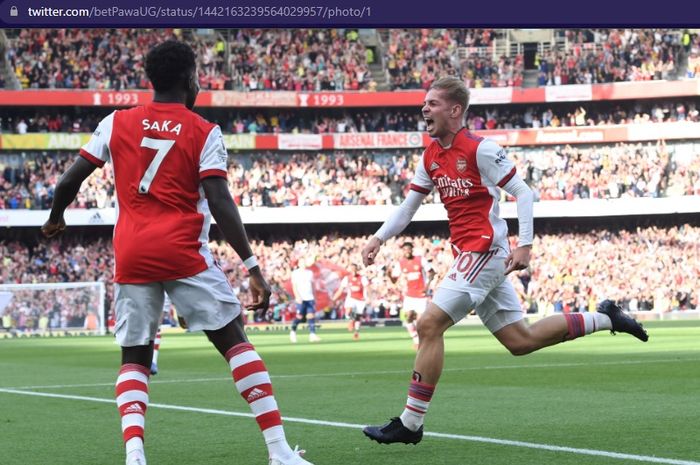 Pemain Arsenal, Bukayo Saka (kiri) dan Emile Smith Rowe, mencetak gol ke gawang Tottenham Hotspur dalam laga pekan keenam Liga Inggris 2021-2022, Minggu (26/9/2021) pukul 22.30 WIB.