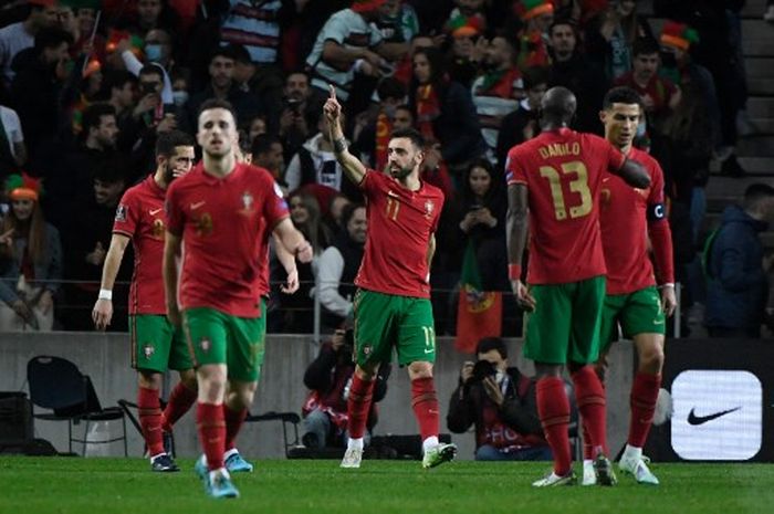 Cristiano Ronaldo mengikuti jejak Lionel Messi setelah membawa Portugal mengalahkan Makedonia Utara sehingga lolos ke Piala Dunia 2022 di Qatar.