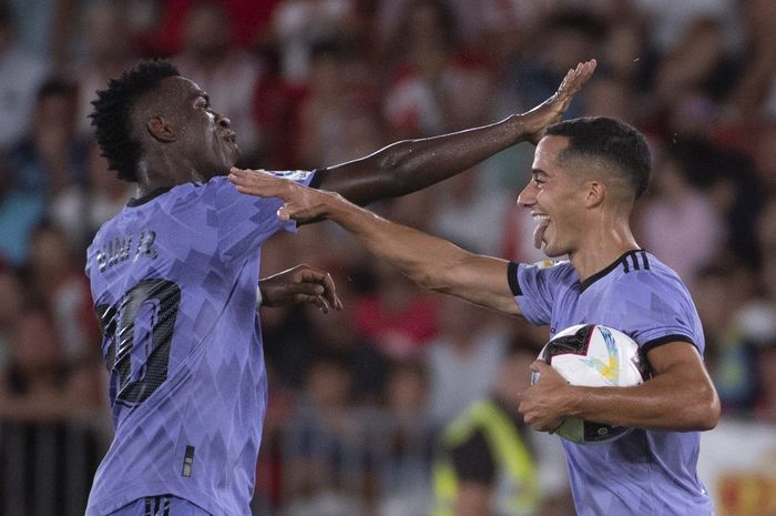 Vinicius Junior dan Lucas Vazquez merayakan gol dalam laga Liga Spanyol, Almeria vs Real Madrid, di Stadion de los Juegos Mediterraneos, Minggu (14/8/2022).