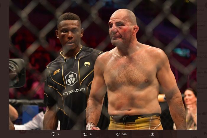 Jamahal Hill (kiri) dan Glover Teixeira (kanan) usai pertarungan mereka di UFC 283  pada Minggu (22/1/2023)