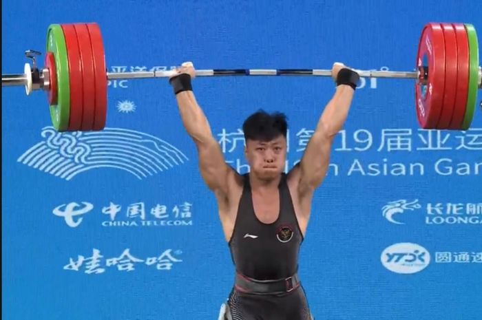 Lifter Indonesia, Rahmat Erwin Abdullah, berhasil merebut emas Asian Games 2022 dari kelas 73kg putra.