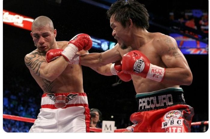 Pertarungan antara Manny Pacquiao (kanan) dengan Miguel Cotto pada 14 November 2009.