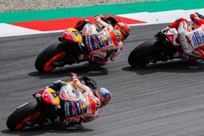 Persaingan Repsol Honda (oranye) dan Ducati (merah) di MotoGP Austria 2017 pada Minggu (13/8/2017)