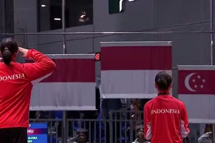 ilustrasi bendera Indonesia dikibarkan  di kompetisi olahraga