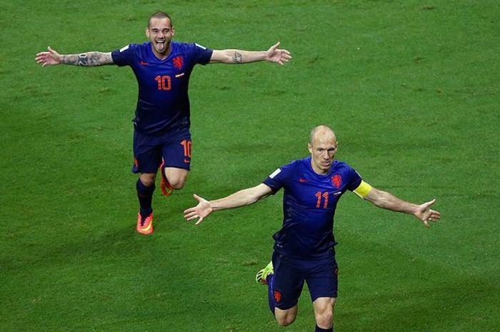 Dua pilar Belanda, Wesley Sneijder dan Arjen Robben, melakukan selebrasi dalam laga melawan Spanyol di Arena Fonte Nova, 13 Juni 2014.