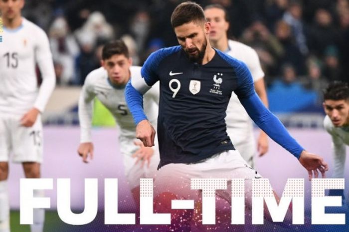 Penyerang timnas Prancis, Olivier Giroud, mencetak gol ke gawang timnas Uruguay dalam laga persahaba