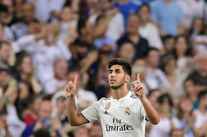 Penyerang Real Madrid, Marco Asensio, merayakan gol yang dicetak ke gawang Espanyol dalam laga Liga Spanyol di Stadion Santiago Bernabeu, Madrid, Spanyol pada 22 September 2018.