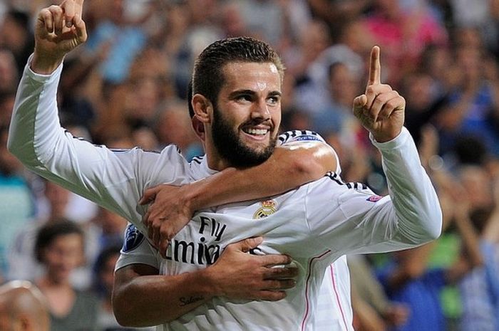 Bek Real Madrid, Nacho Fernandez, saat merayakan gol yang berhasil ia cetak ke gawang FC Basel dalam pertandingan Liga Champions 2014-2015 di Stadion Santiago Bernabeu, Madrid, Spanyol, pada 16 September 2014.