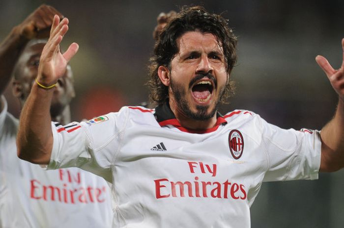 Gennaro Gattuso merayakan keunggulan AC Milan atas Fiorentina dalam partai Liga Italia di Artemio Franchi, Florence, 10 April 2011.