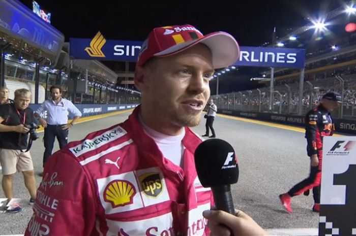 Sebastian Vettel saat diwawancara usai meraih pole position pada sesi kualifikasi GP Singapura yang digelar Sabtu (16/9/2017).