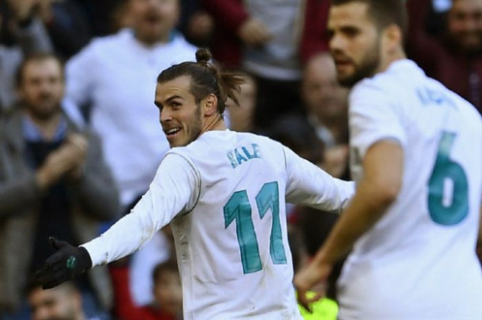 Winger Real Madrid, Gareth Bale, melakukan selebrasi seusai menjebol gawnag Deportivo La Coruna dalam partai Liga Spanyol di Santiago Bernabeu, Minggu (21/1/2018)