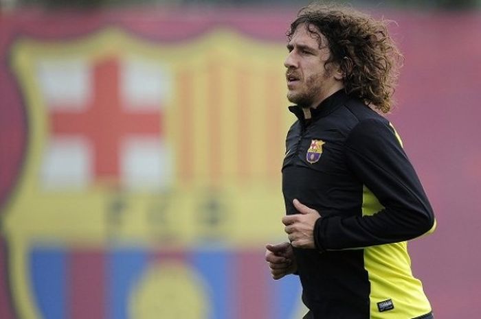  Mantan kapten Barcelona, Carles Puyol, kala masih aktif berkarier sebagai pesepak bola. Puyol gantung sepatu pada akhir musim 2013-2014. 