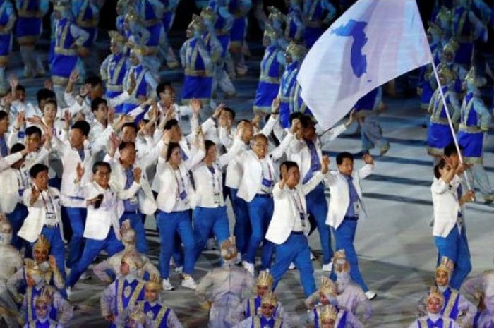 Korea Selatan dan Korea Utara bersatu dalam satu bendera unifikasi pada defile pembukaan Asian Games