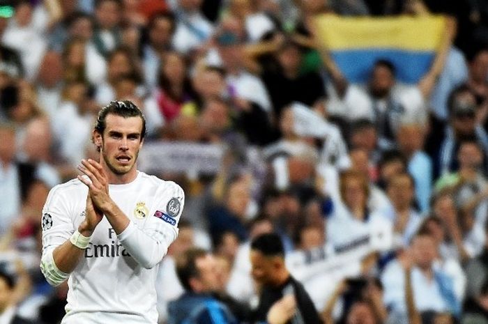 Winger Real Madrid, Gareth Bale, merayakan keberhasilan timnya lolos ke final Liga Champions. 