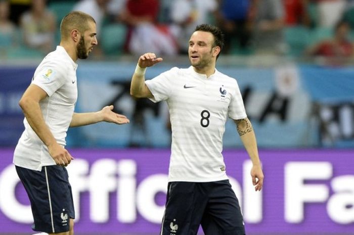 Karim Benzema (kiri) dan Mathieu Valbuena saat membela Prancis di Piala Dunia 2014 di Brasil pada 20 Juni. 