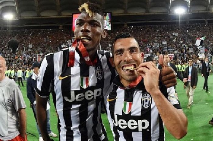 Paul Pogba dan Carlos Tevez merayakan kemenangan Juventus di final Coppa Italia, 20 Mei 2015 di Roma, Italia