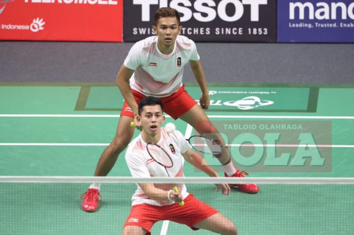  Fajar Alfian (atas) dan Muhammad Rian Ardianto (bawah) saat melakoni partai final bulu tangkis nomor ganda putra Asian Games 2018, Selasa (28/8/2018). 