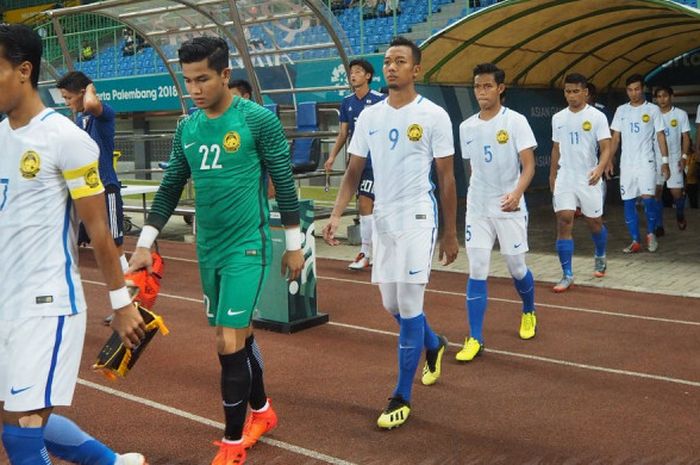 Para pemain timnas U-23 Malaysia saat bertanding melawan timnas U-23 Jepang  dalam babak 16 besar Aisan Games 2018 di Stadion Patriot Chandrabhaga, Kota Bekasi, Jumat (24/8/2018).