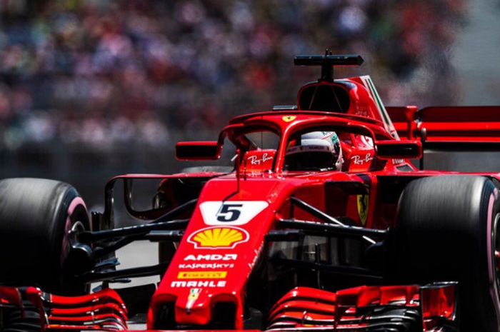 Pebalap Ferrari, Sebastian Vettel, saat beraksi pada kualifikasi F1 GP Kanada di Sirkuit Gilles-Villeneuve, Montreal, Kanada, Minggu (10/6/2018).
