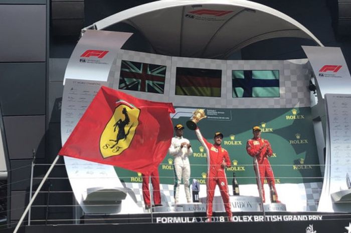 Lewis Hamilton, Sebastian Vettel, dan Kimi Raikkonen, merayakan podium GP Inggris di Sirkuit Silverstone, Inggris, Minggu (8/7/2018).