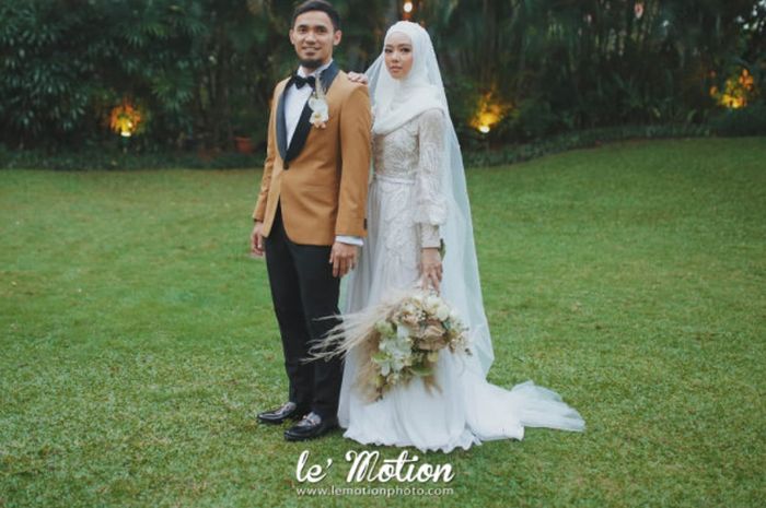 Foto pernikahan pasangan atlet wushu nasional Indonesia, Achmad Hulaefi dan Lindswell Kwok, yang telah resmi melangsungkan resepsi pernikahan di Hotel Ayana Midplaza, Jakarta, Minggu (9/12/2018) malam.