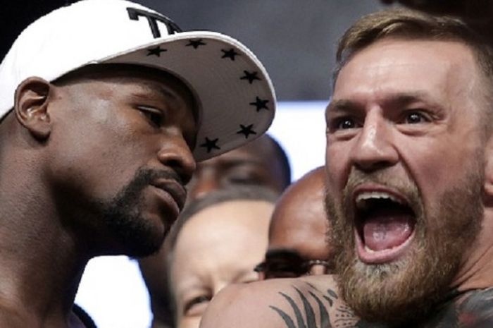    Perang urat syaraf sudah dilakukan Conor McGregor dan Floyd Mayweather pada acara timbang badan jelang pertarungan keduanya, Jumat (25/8/2017).    