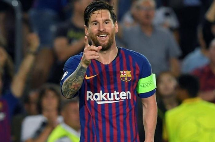   Lionel Messi merayakan golnya untuk FC Barcelona ke gawang PSV Eindhoven dalam partai Liga Champions di Camp Nou, Barcelona, 18 September 2018.  