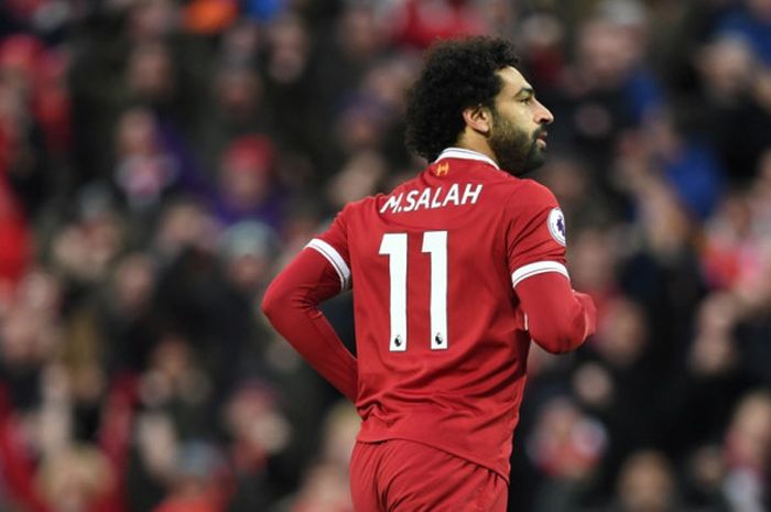  Pemain Liverpool FC, Mohamed Salah, merayakan gol yang dia cetak ke gawang Tottenham Hotspur dalam laga Liga Inggtis di Stadion Anfield, Liverpool, pada 4 Februari 2018. 