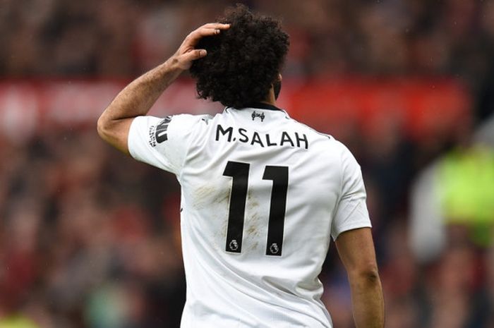   Ekspresi winger Liverpool FC, Mohamed Salah, dalam laga Liga Inggris kontra Manchester United di Stadion Old Trafford, Manchester, pada 10 Maret 2018.       