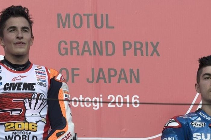 Dari kiri ke kanan, Marc Marquez (Repsol Honda) dan Maverick Vinales (Suzuki Ecstar) berada di podium setelah menjalani GP Jepang di Sirkuit Twin Ring Motegi, Minggu (16/10/2016).