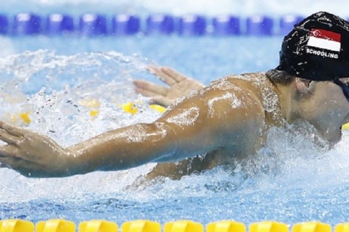 Joseph Schooling meraih medali emas nomor 100 meter gaya kupu-kupu di Olimpiade Rio 2016, Jumat (12/8/2016).