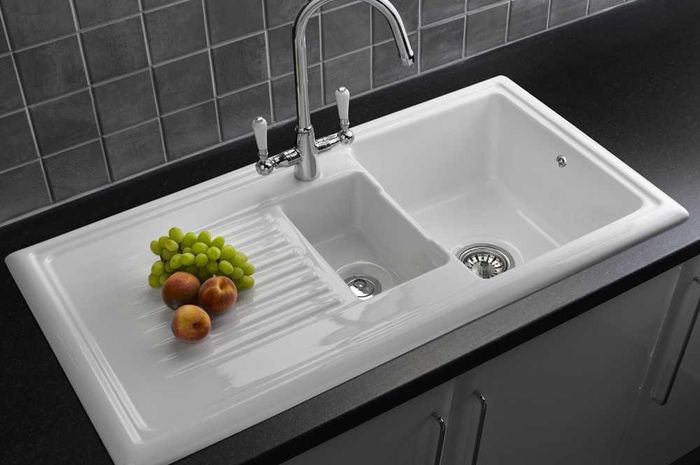 white porcelain single bowl kitchen sink