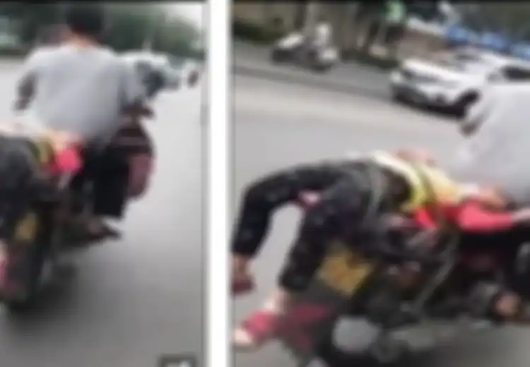 (Video) Duh, Seorang Ayah Antar Putrinya ke Sekolah Dengan Cara Diikat di Jok Motor